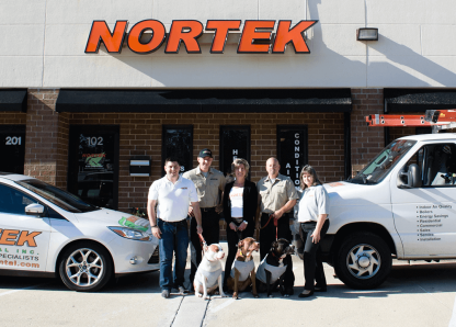 Lisa and others in front of Nortek Environmental, Inc.'s building